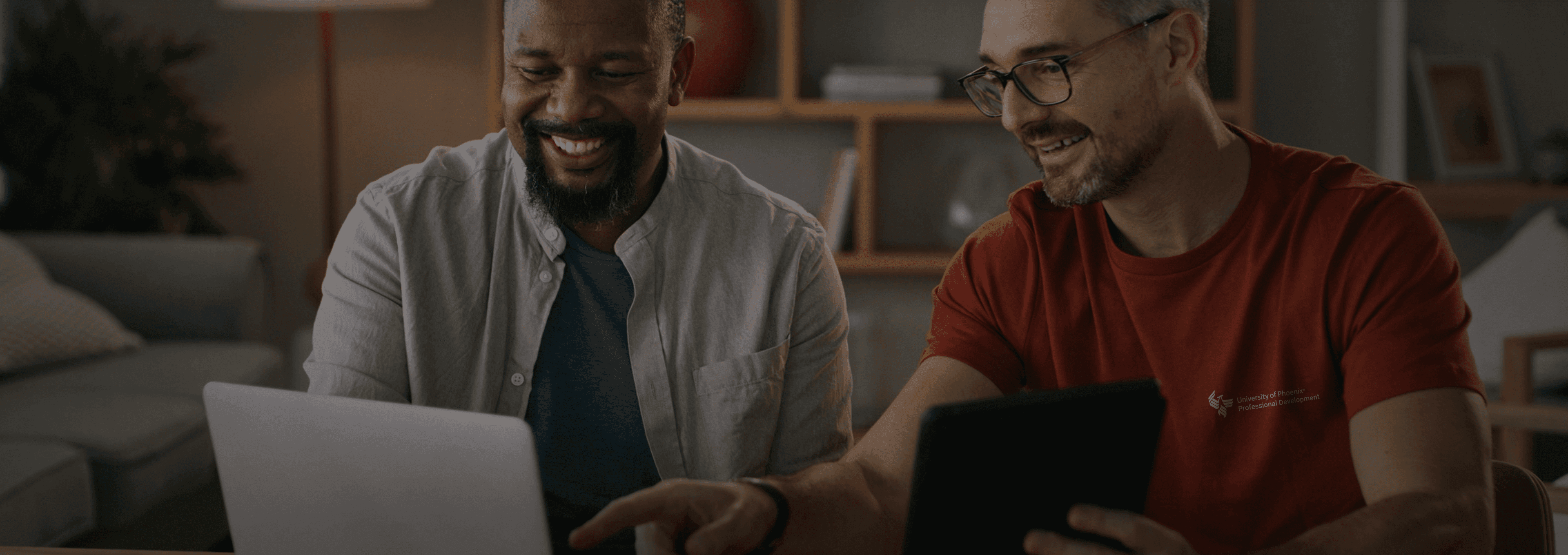 two men looking at laptop